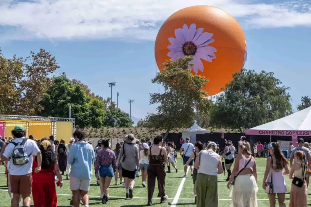Festival goers arrive at the Great Park for the inaugural...