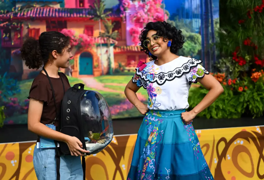 Mirabel Madrigal, from the Encanto greets Scarlett Lopez, 12, and...