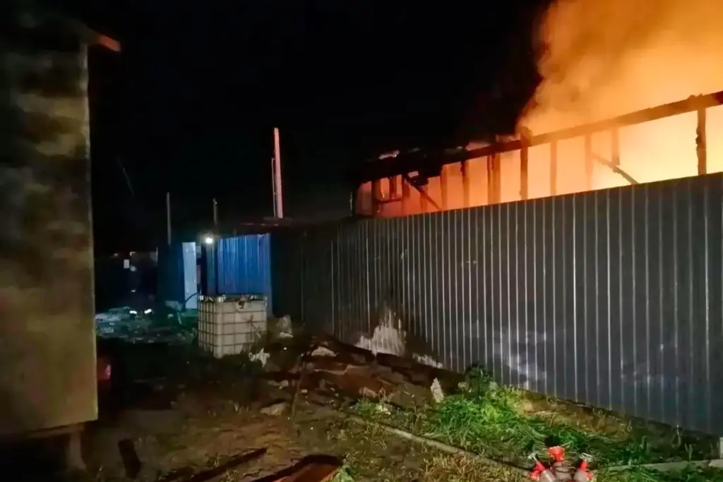 Flames and smoke rise from a construction site after a Ukrainian drone attack.