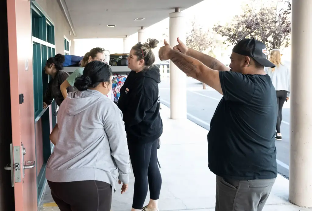 Parents say good-bye to their kids during the first day...