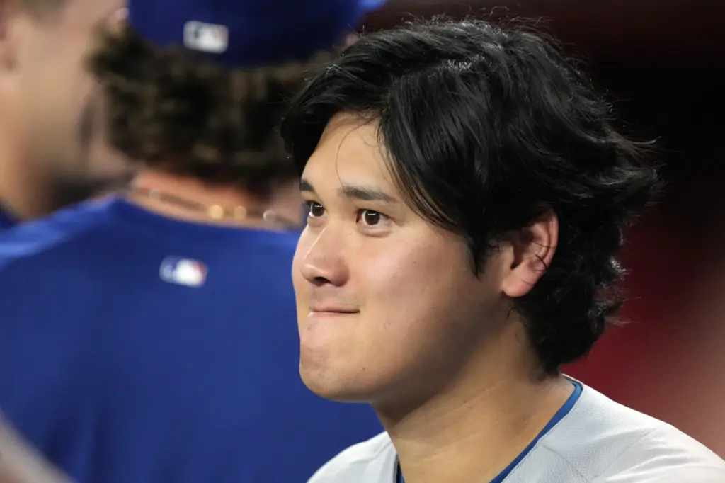 Dodgers star Shohei Ohtani looks on during a game against...