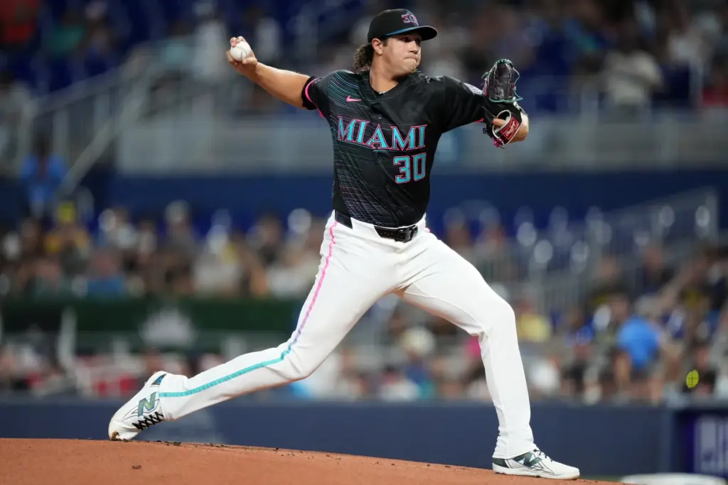 Miami Marlins starting pitcher Tyler Phillips throws to the plate...