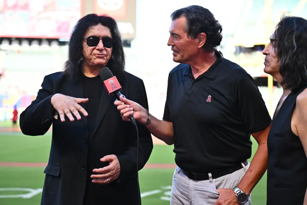 Gene Simmons, left, from the band KISS is interviewed before...
