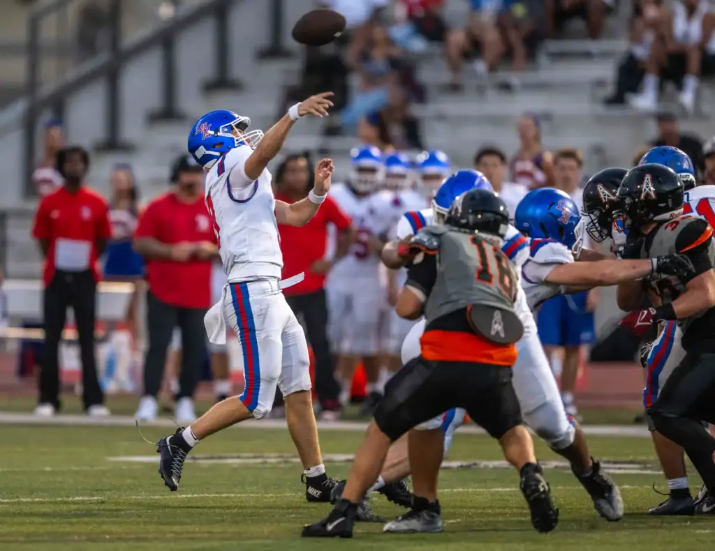 Los Alamitos quarterback Luke Osborn (9) throws the ball during...