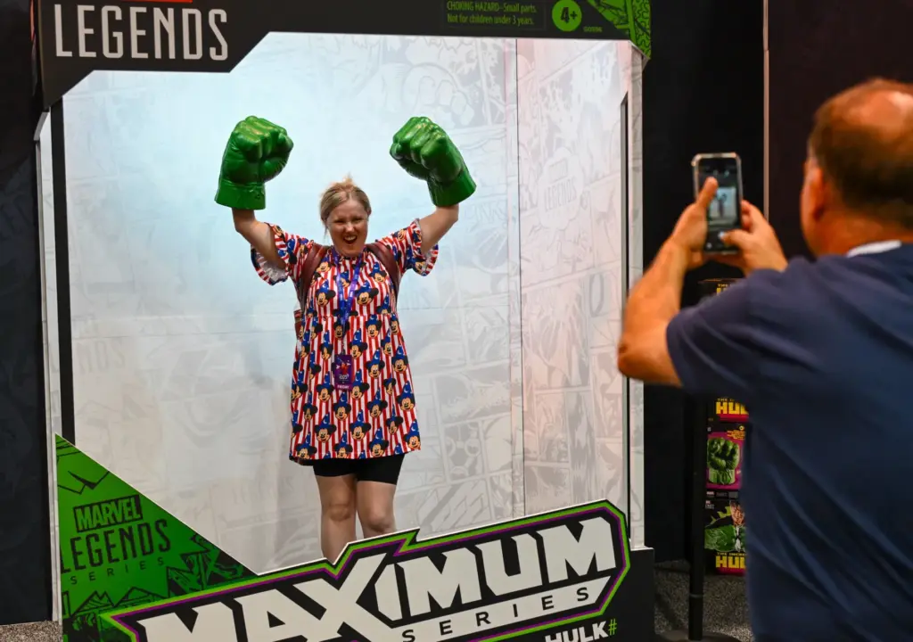 Jo Bray, visiting from the U.K., poses with Hulk hands...