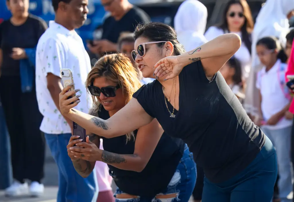 Patty Soto snaps some photos of her child before class...