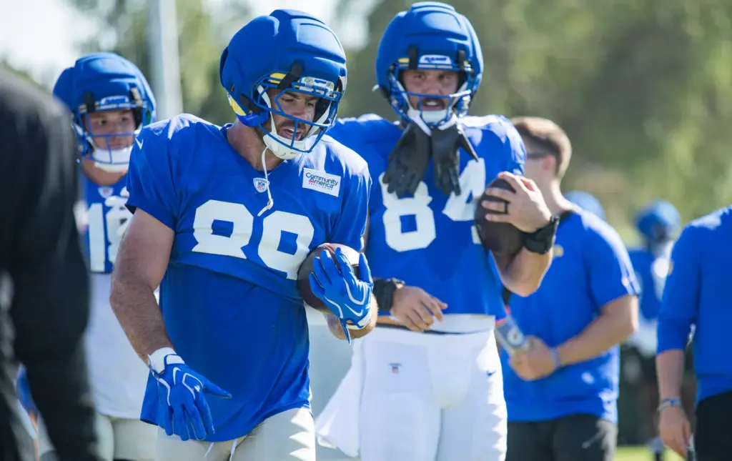 Rams tight end Tyler Higbee cradles a ball during a...