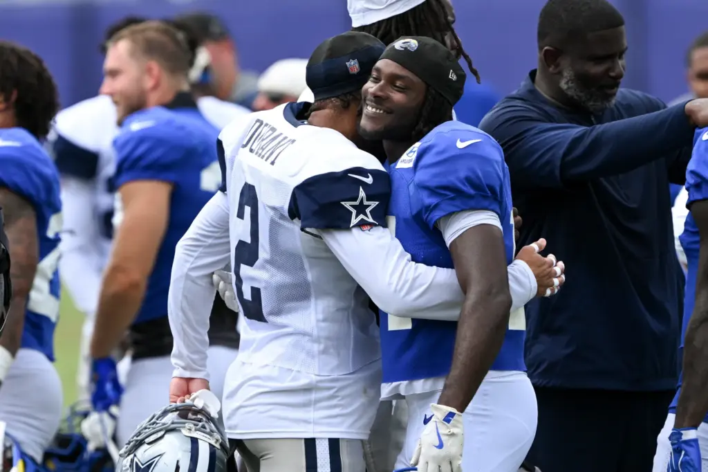 Rams wide receiver Mario Williams, right, and Dallas Cowboys defensive...