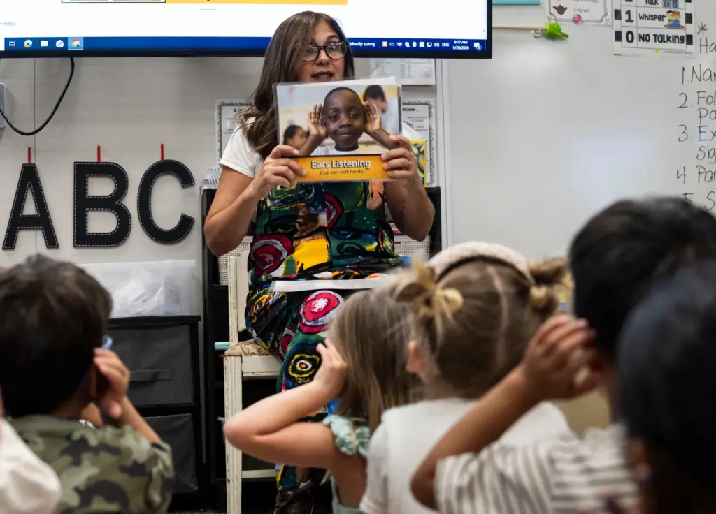 Teacher Pamela Padian talks to her kindergarten class during the...