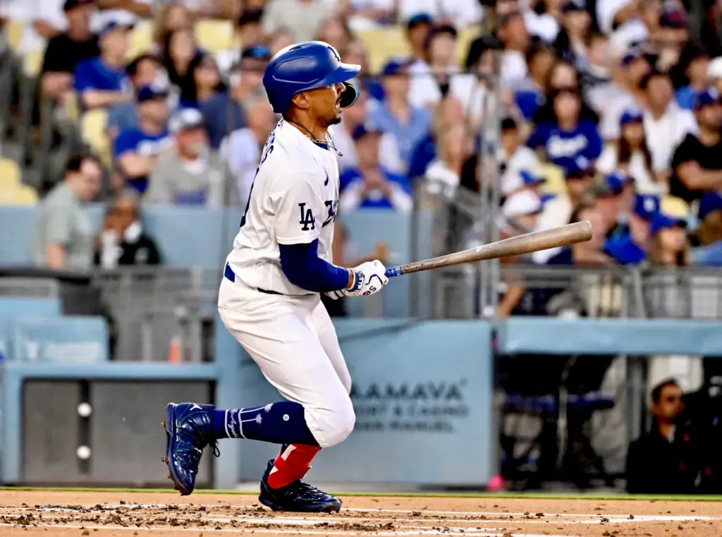 The Dodgers’ Mookie Betts watches the flight of his solo...