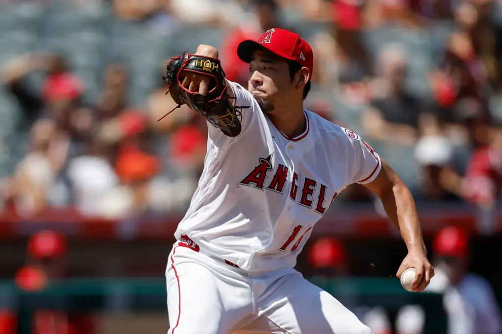 Angels starting pitcher Yusei Kikuchi throws during the first inning...