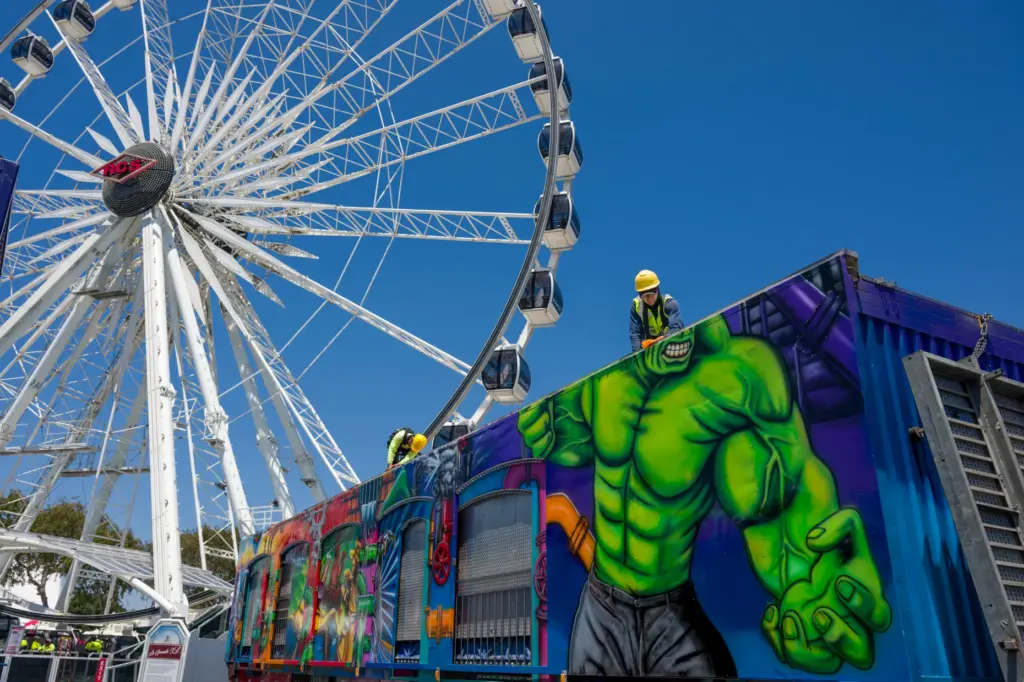 The La Grande XL Observation Wheel looms over crews as...