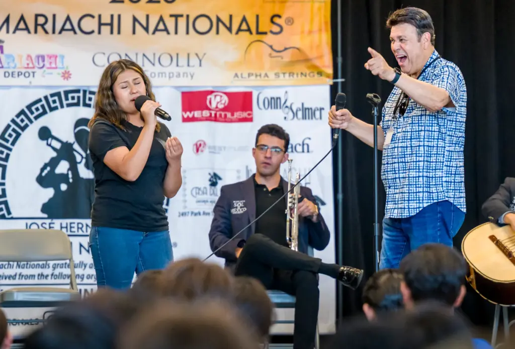 Master Musician JosÃ© HernÃ¡ndez, right, reacts when Heidi Velasco, 16,...