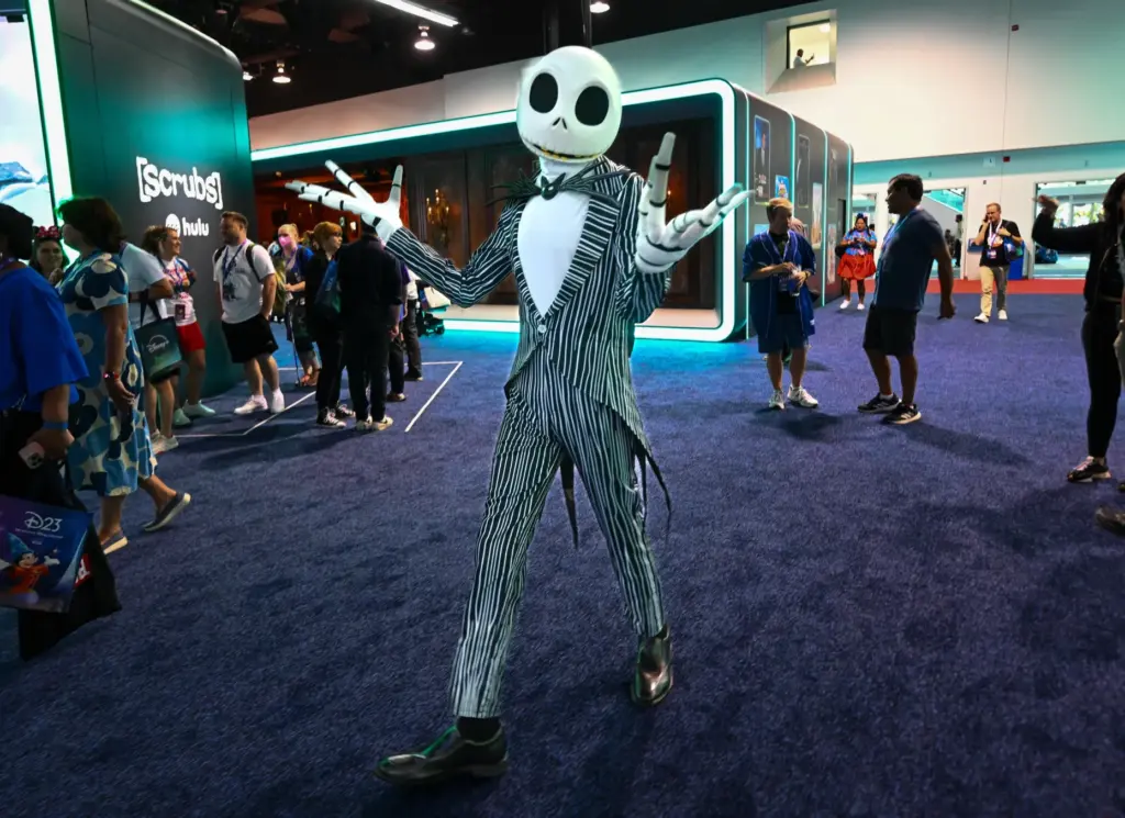 Jack Skellington walks through the Disney+ Hulu booth during the...