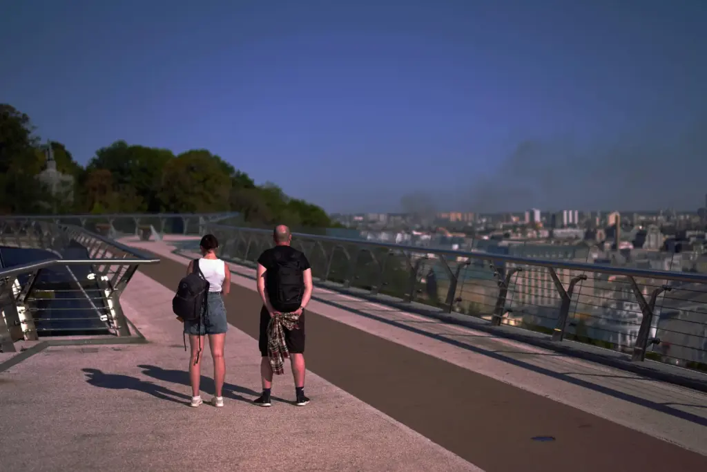 People in Kyiv observe a daily nationwide minute of silence in memory of soldiers killed.