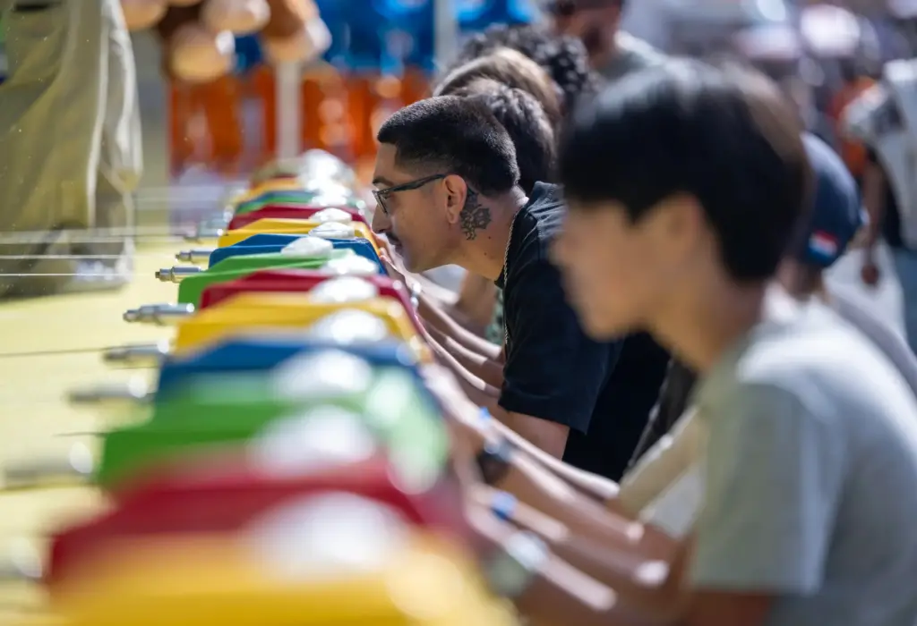 Fairgoers play the popular water race game at the OC...