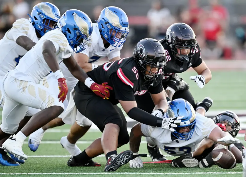 Santa Margaritaâs Isaia Vandermade (53) forces and recovers the fumble...