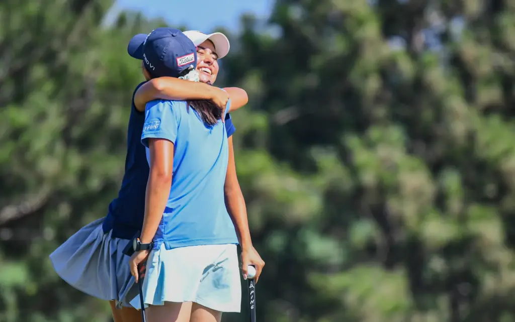 Alexis Lamadrid (left) and Gabriella Gu (right) embrace after Lamadrid...