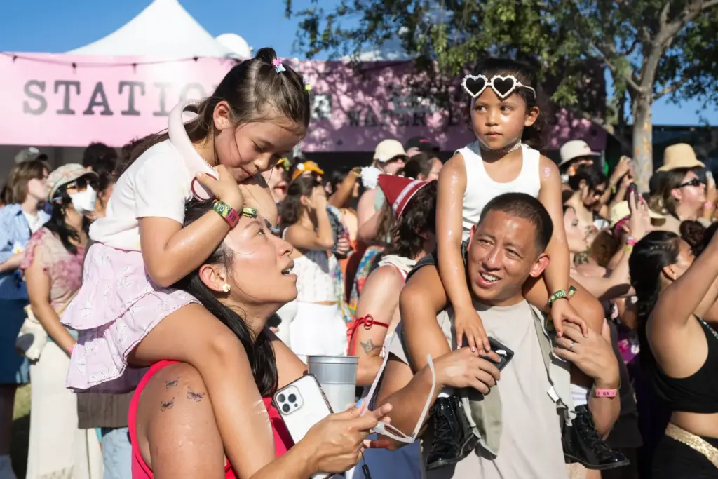 Festivalgoers endure the August heat during the Daisy Chain Fields...