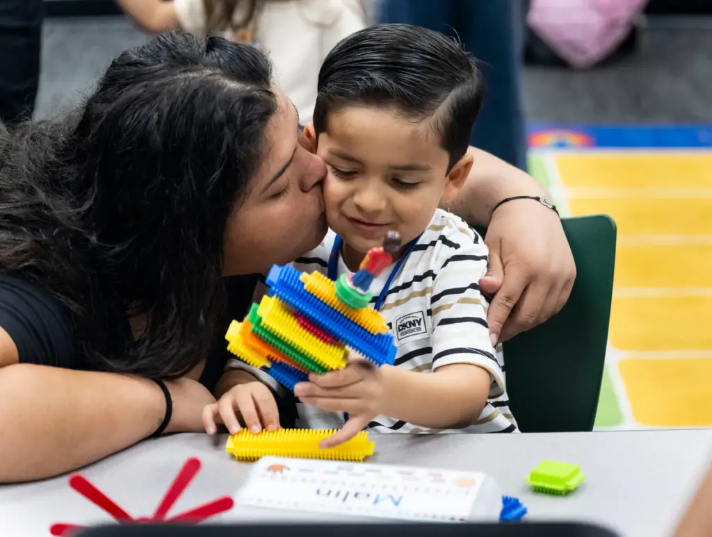 Malin Ramos gets a good-bye kiss from his mom Esperanza...
