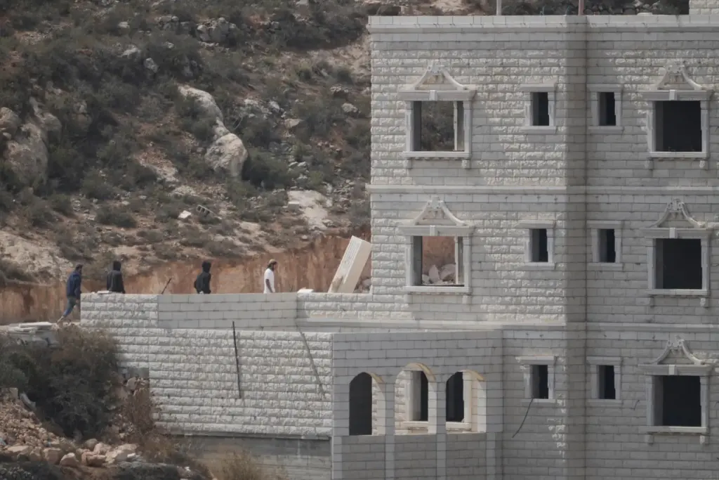 Israeli settlers enter Palestinian properties in the occupied West Bank...