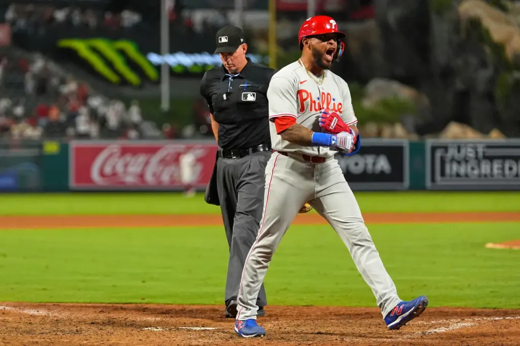 The Philadelphia Phillies’ Edmundo Sosa celebrates as he crosses home...