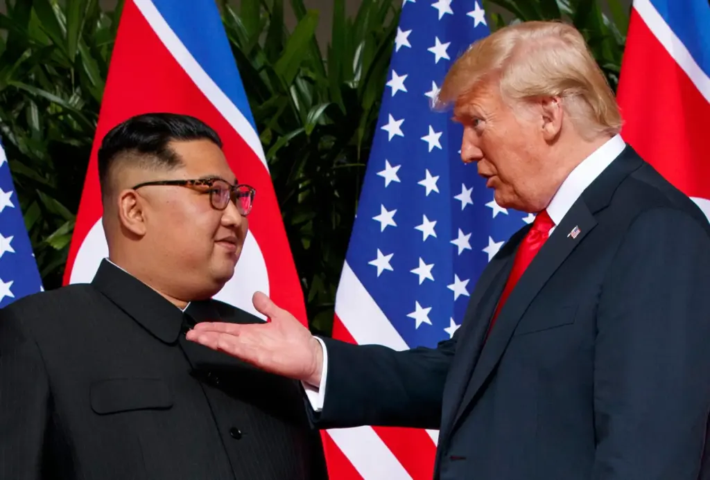 President Donald Trump gestures while talking with North Korean leader Kim Jong Un.