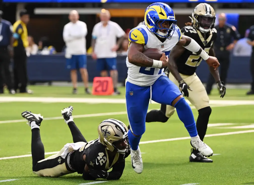 Rams running back Jarquez Hunter (27) runs over New Orleans...