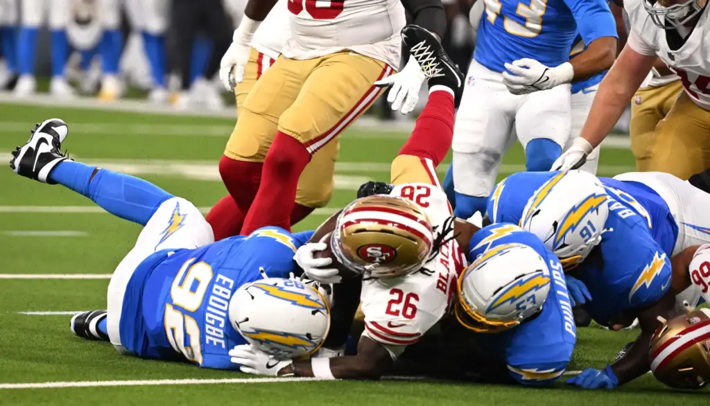 San Francisco 49ers running back Kaelon Black (26) is tackled...