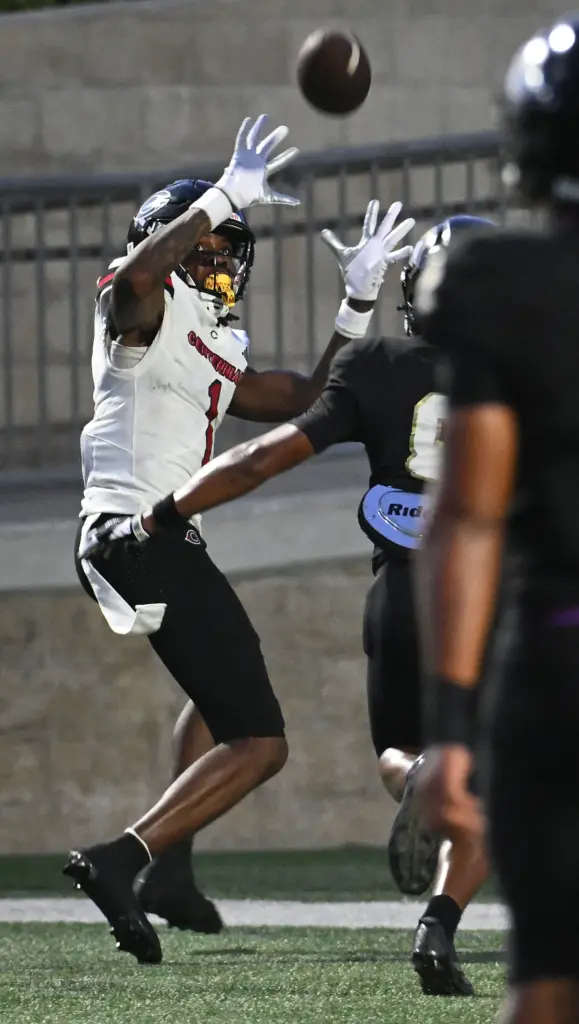 Centennialâs Quentin Hale (1) catches a touchdown pass against Servite...