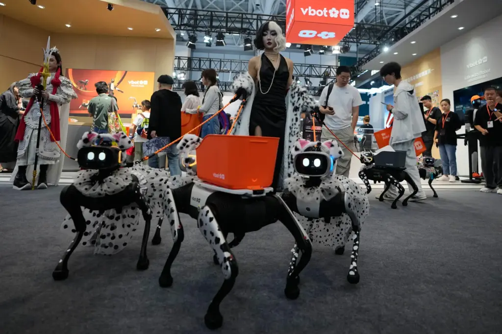 A model shows her fancy dressed-up robotic dogs.