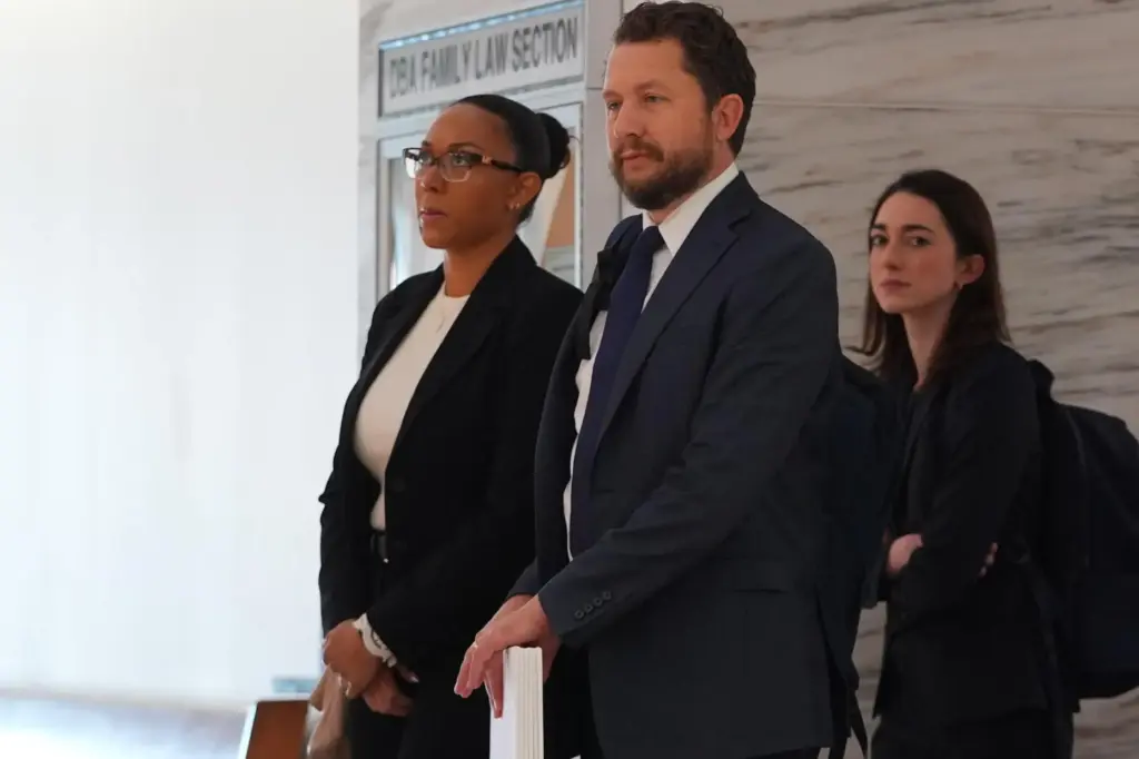 McKenna West, left, arrivers with her legal team for a...