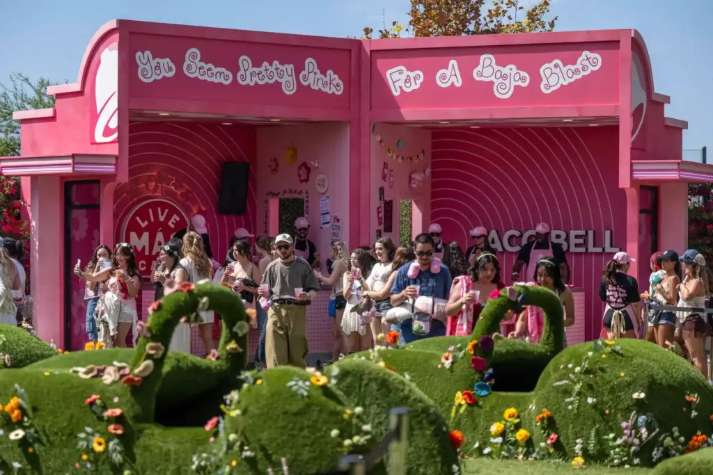 Festivalgoers visit Olivia Rodrigoâs dollhouse-inspired Taco Bell Live MÃ¡s CafÃ©,...