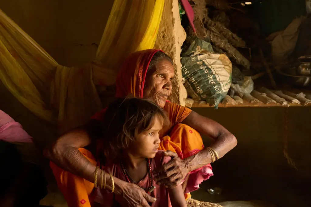 Lachhiya Devi sits with her 5-year-old granddaughter, Sonam Mukhiya.