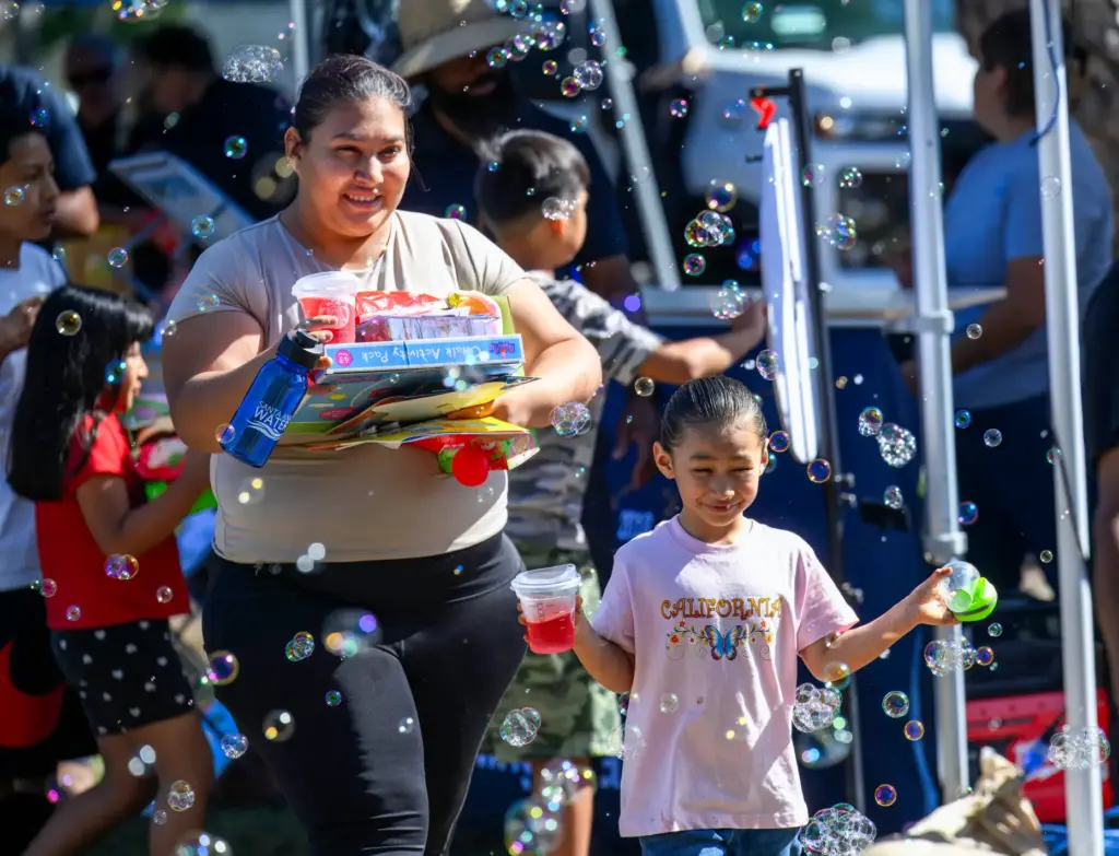Jenifer Urias, left, and her daughter Cataleya check out the...