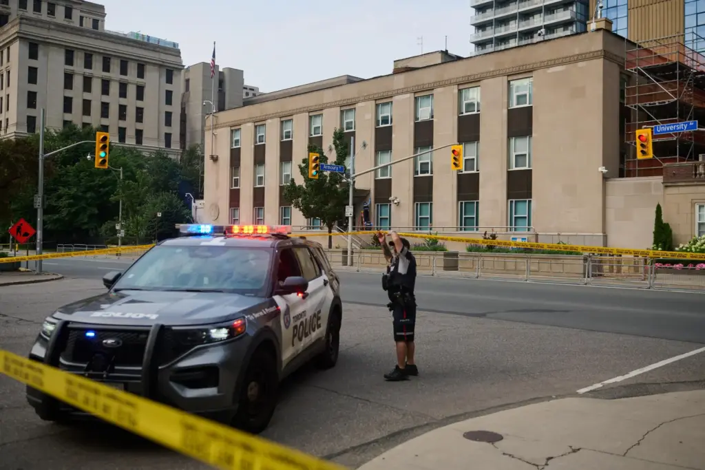 Police work the scene of an early morning shooting outside...