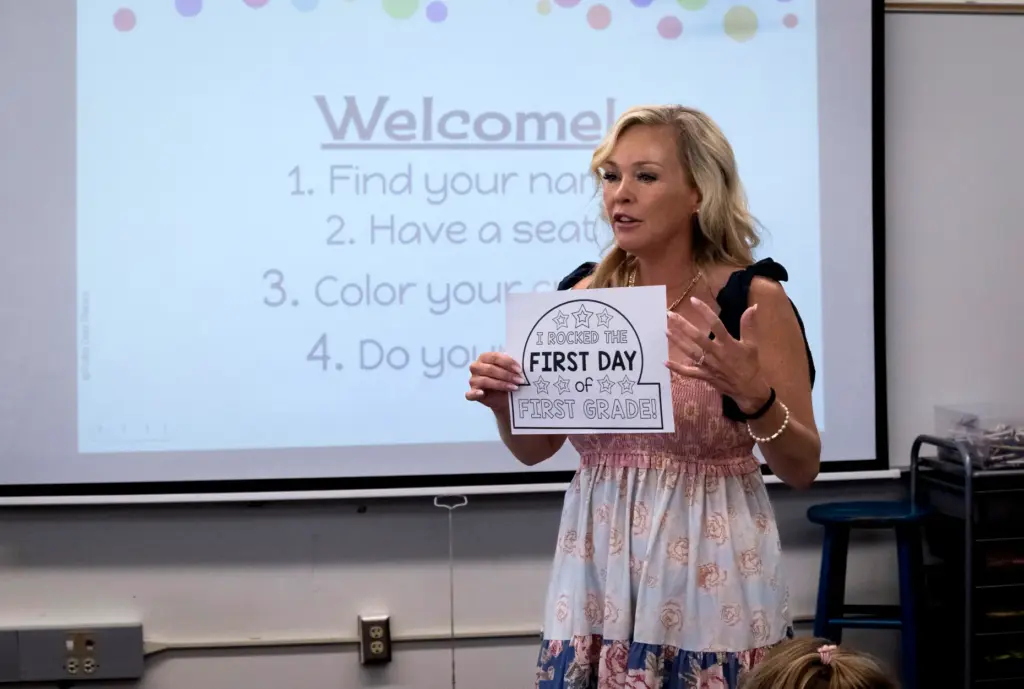 First-grade teacher Katie Danahy gives her students a coloring assignment...