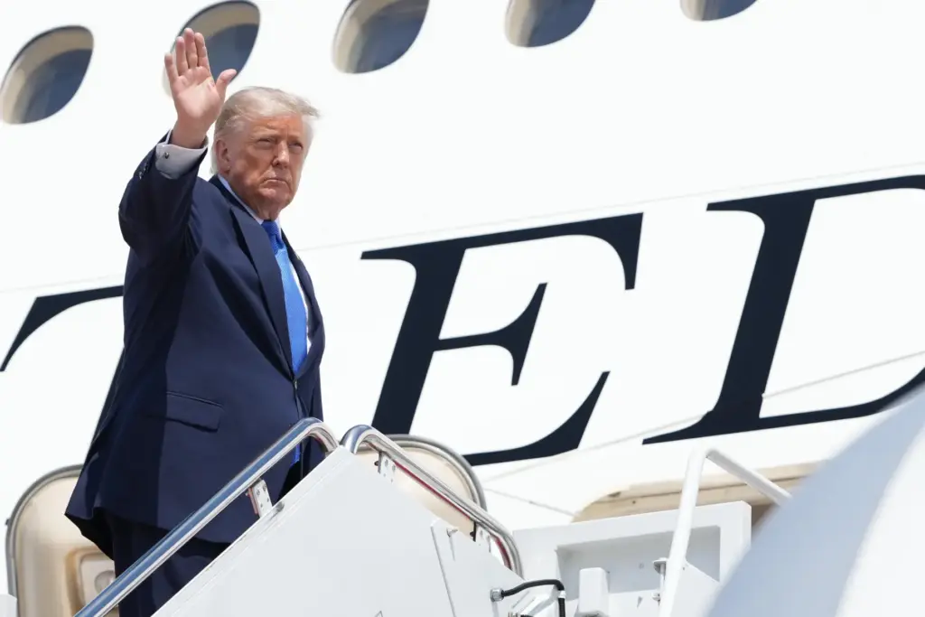 President Donald Trump boards Air Force One.