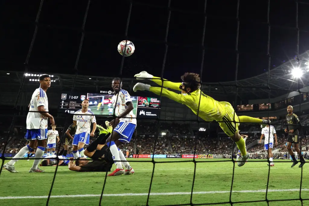 San Diego FC goalkeeper CJ Dos Santos makes a save...