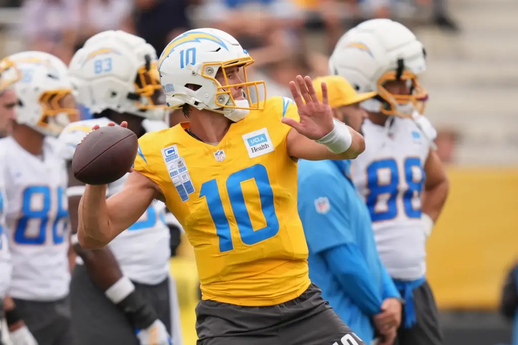 Chargers quarterback Justin Herbert throws a pass during a training...