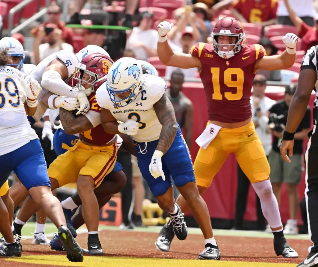 Riley Wormley (27) of the USC Trojans runs for the...
