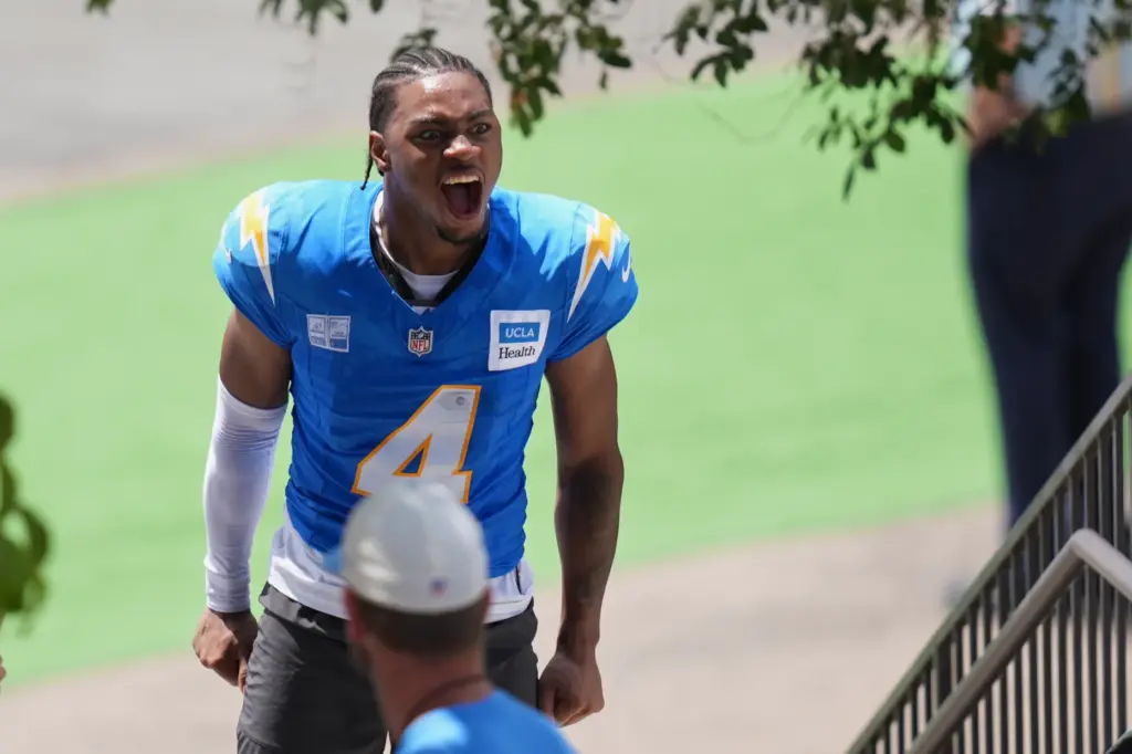 Chargers cornerback Tarheeb Still greets fans during an NFL football...