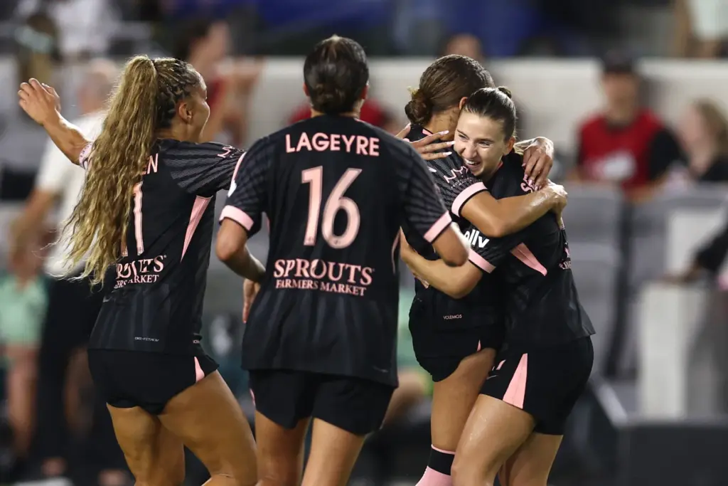 Angel City FC midfielder Ally Sentnor, right, celebrates with teammates...