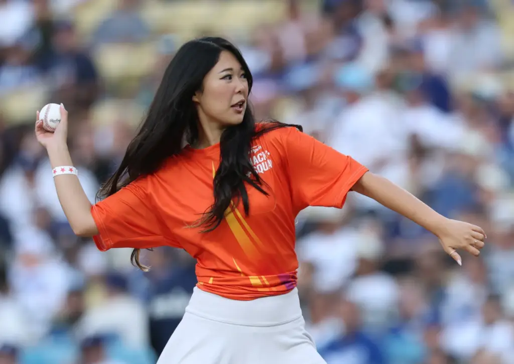 Digital content creator ExtraEmily (Emily Zhang) throws out a ceremonial...