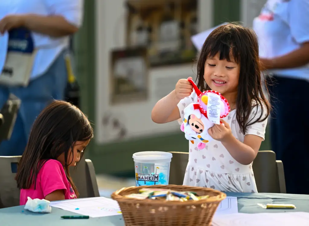 Serena Sayas, 5, and Chloe Van, 5, play with baby...