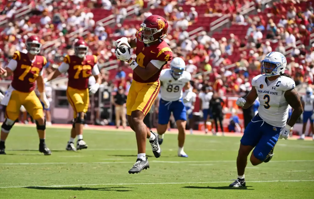 Wide receiver Trent Mosley (4) of the USC Trojans catches...