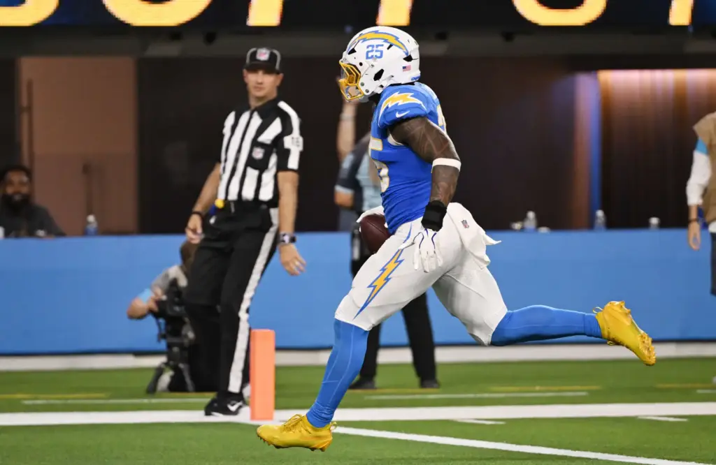 Chargers linebacker Junior Colson returns an interception 16 yards for...