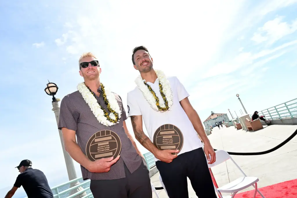 Chase Budinger and Miles Evans hold their plaques after the...