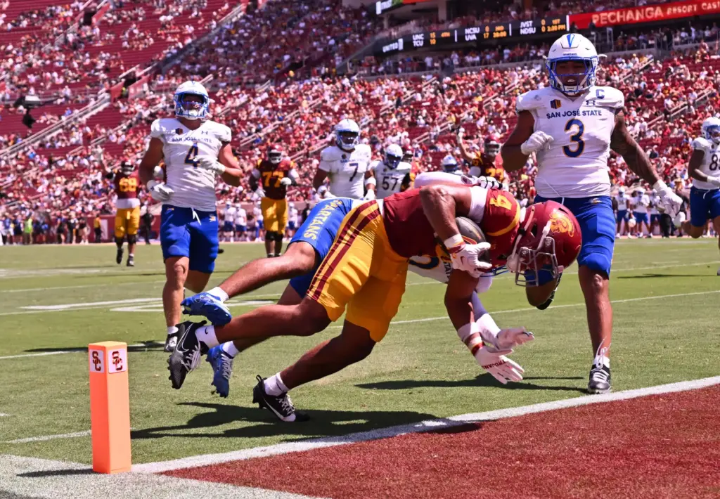 Wide receiver Trent Mosley (4) of the USC Trojans catches...