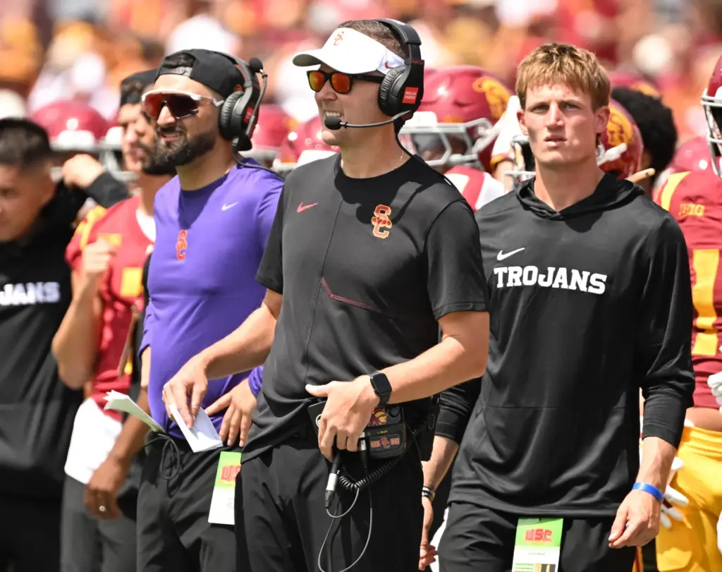 Head coach Lincoln Riley of the USC Trojans looks on...